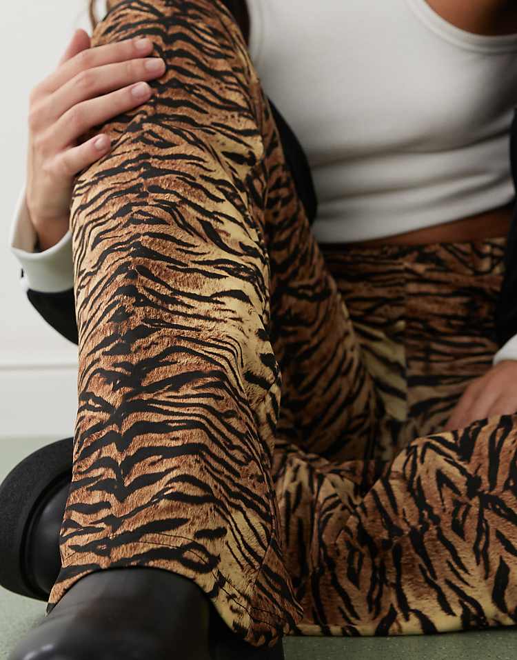https://images.asos-media.com/products/noisy-may-tiger-print-flare-pants-in-brown/206879734-3?$n_750w$&wid=750&fit=constrain
