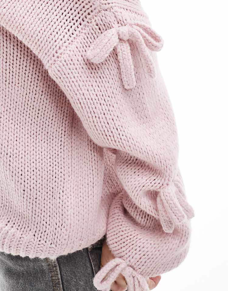 https://images.asos-media.com/products/hollister-slouchy-off-the-shoulder-applique-bow-knit-sweater-in-lilac/207900902-4?$n_750w$&wid=750&fit=constrain