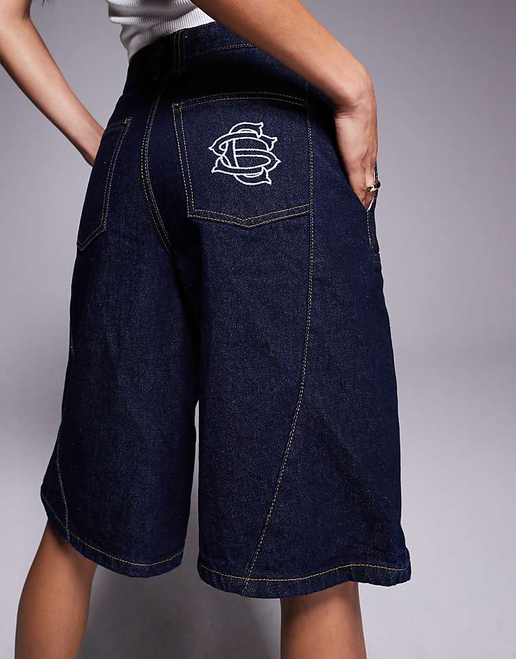 https://images.asos-media.com/products/courtside-panel-detail-denim-jorts-with-back-pocket-logo-embroidery-in-indigo/208452320-2?$n_750w$&wid=750&fit=constrain