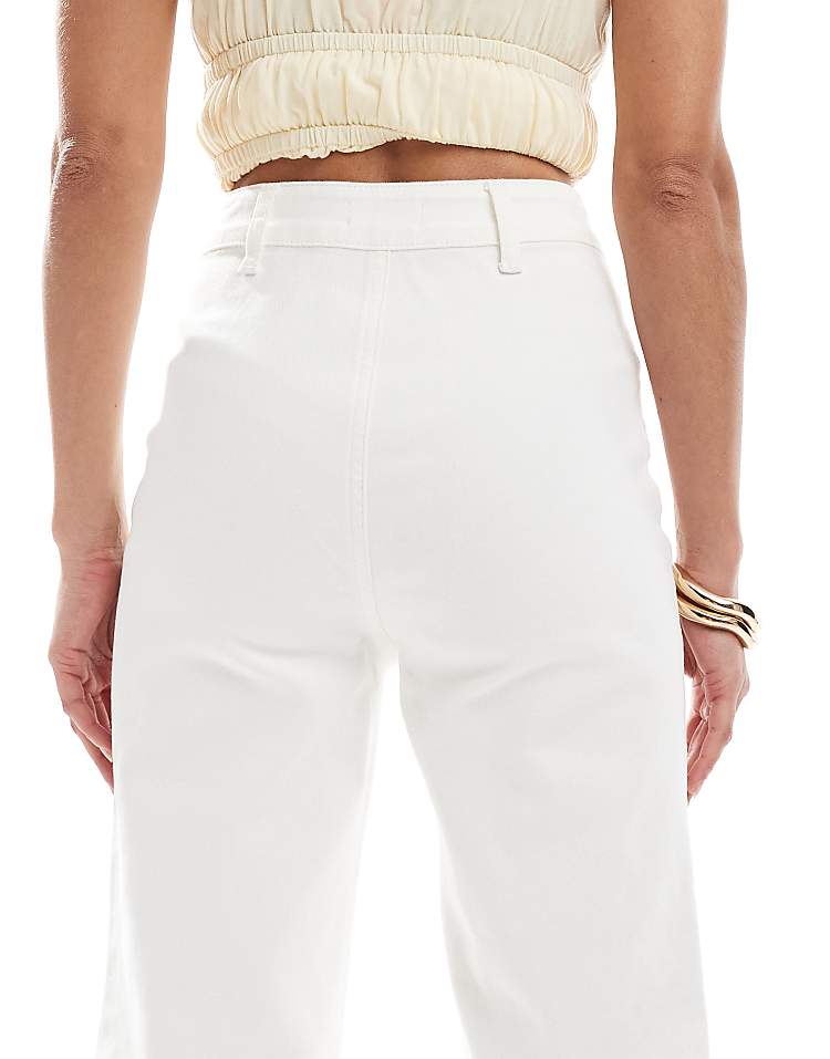 https://images.asos-media.com/products/miss-selfridge-patch-pocket-high-waist-70s-denim-flare-in-ecru-wash/208542246-4?$n_750w$&wid=750&fit=constrain
