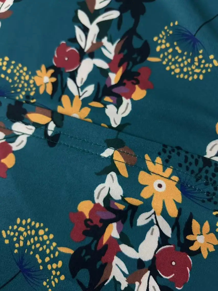 Plus-size floral print vacation style jumpsuit with pockets