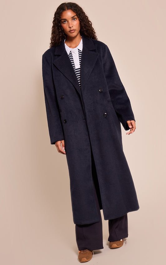 https://cdn-img.prettylittlething.com/0/f/3/1/0f31ccf21e0bddf8bd4467d7206d9f50d7825cd8_CNN8428_1_navy_structured_double_breasted_wool_look_maxi_coat.jpg