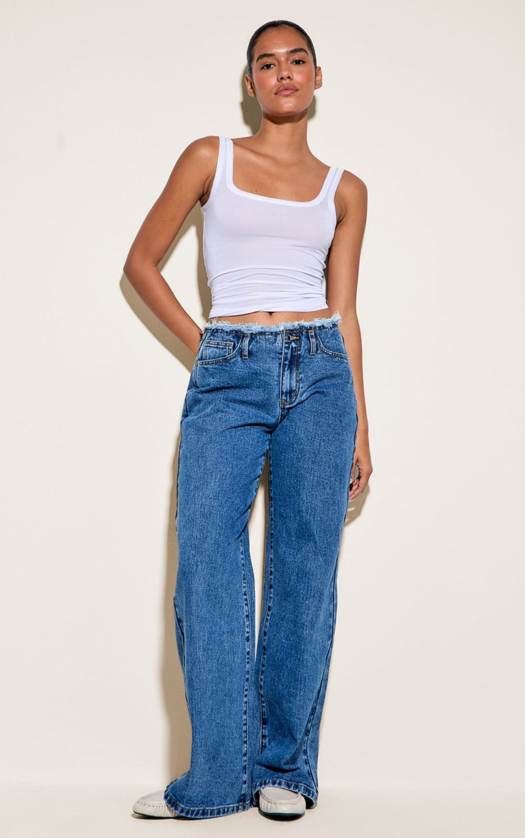https://cdn-img.prettylittlething.com/1/2/6/0/12603547fcad3ddc3e2eba0f4c9f442a30b6bfa6_CNN6887_1_mid_blue_wash_fray_waistband_low_waist_straight_leg_jean.jpg