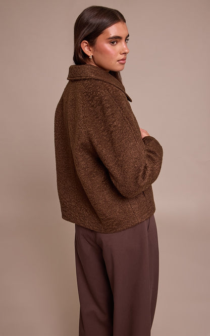https://cdn-img.prettylittlething.com/1/c/f/e/1cfe8108e9ad02bf54445d57c85a40900eebc35e_CNN8436_2_chocolate_boucle_zip_up_jacket.jpg