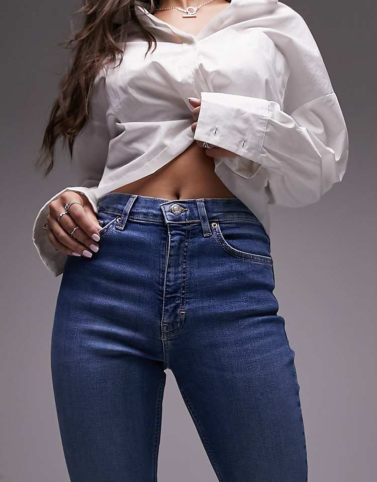 https://images.asos-media.com/products/topshop-hourglass-jamie-flare-high-rise-jeans-in-mid-blue/202355870-5?$n_750w$&wid=750&fit=constrain