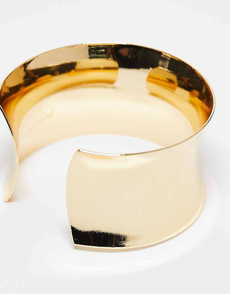 https://images.asos-media.com/products/asos-design-wide-cuff-bracelet-in-gold-tone/205502764-2?$n_750w$&wid=750&fit=constrain