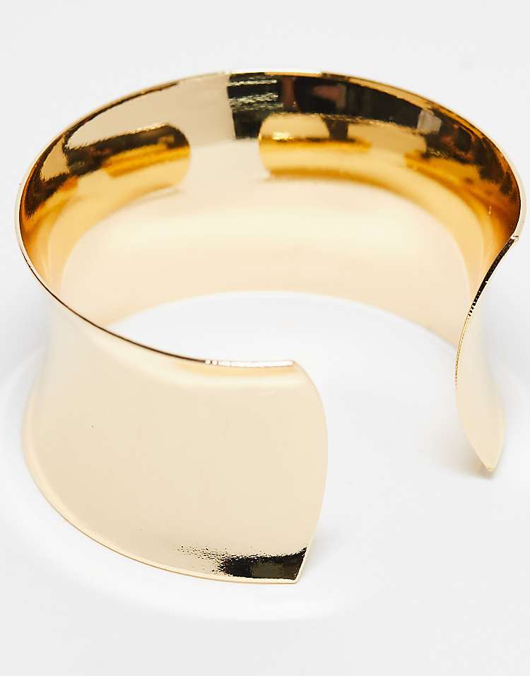 https://images.asos-media.com/products/asos-design-wide-cuff-bracelet-in-gold-tone/205502764-4?$n_750w$&wid=750&fit=constrain