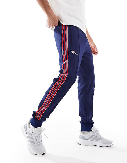 https://images.asos-media.com/products/adidas-football-arsenal-icons-trackpants-in-navy-and-red/207197386-2?$n_750w$&wid=750&fit=constrain