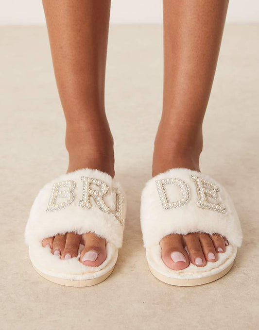 https://images.asos-media.com/products/be-mine-sasha-bridal-slippers-in-ivory/207633695-1-ivory?$n_750w$&wid=750&fit=constrain
