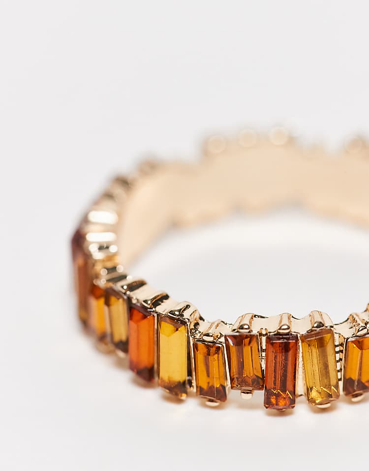 https://images.asos-media.com/products/asos-design-baguette-ring-with-amber-tonal-stones-in-gold-tone/207919020-2?$n_750w$&wid=750&fit=constrain