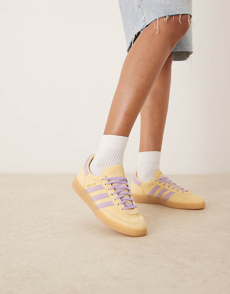 https://images.asos-media.com/products/adidas-originals-handball-spezial-sneakers-in-orange-and-purple/207951662-1-orange?$n_750w$&wid=750&fit=constrain