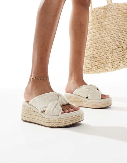https://images.asos-media.com/products/asos-design-thoughtful-knot-detail-flatform-mules-in-natural/207968531-4?$n_750w$&wid=750&fit=constrain