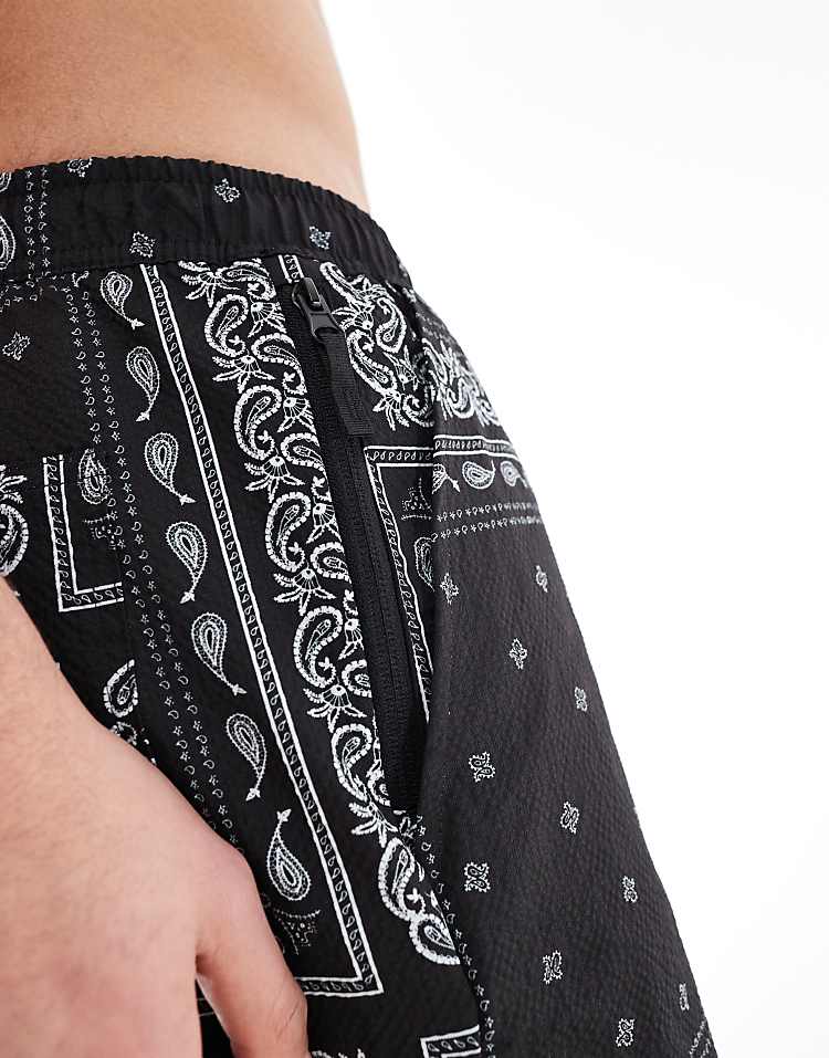 https://images.asos-media.com/products/river-island-swim-shorts-in-black-bandana-print/208146895-3?$n_750w$&wid=750&fit=constrain