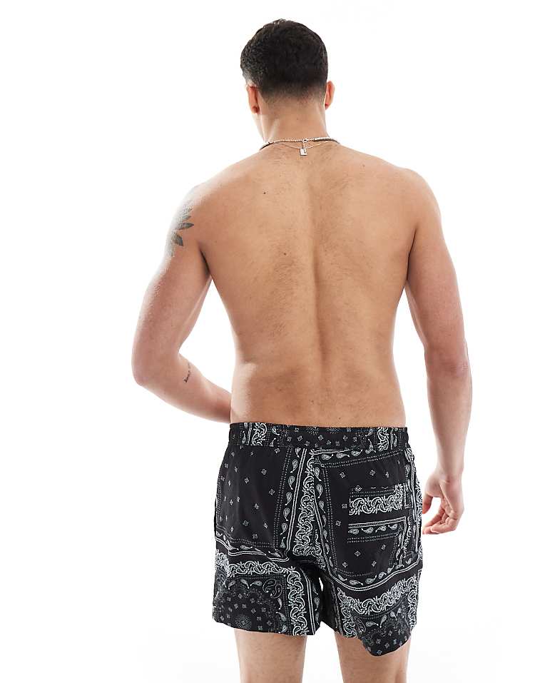 https://images.asos-media.com/products/river-island-swim-shorts-in-black-bandana-print/208146895-4?$n_750w$&wid=750&fit=constrain