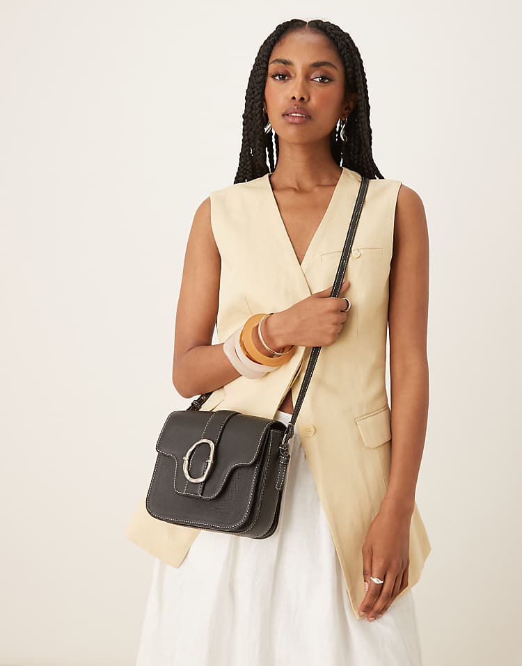 https://images.asos-media.com/products/becksondergaard-iris-leather-crossbody-buckle-bag-in-black/208153274-2?$n_750w$&wid=750&fit=constrain