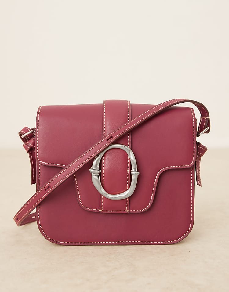 https://images.asos-media.com/products/becksondergaard-iris-leather-crossbody-buckle-bag-in-burgundy/208153292-1-burgundy?$n_750w$&wid=750&fit=constrain