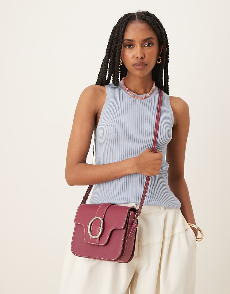 https://images.asos-media.com/products/becksondergaard-iris-leather-crossbody-buckle-bag-in-burgundy/208153292-5?$n_750w$&wid=750&fit=constrain