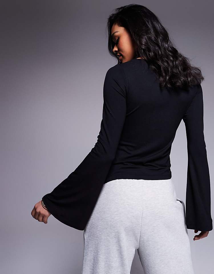 https://images.asos-media.com/products/asos-design-angel-sleeve-top-with-flare-detail-in-black/208369878-4?$n_750w$&wid=750&fit=constrain