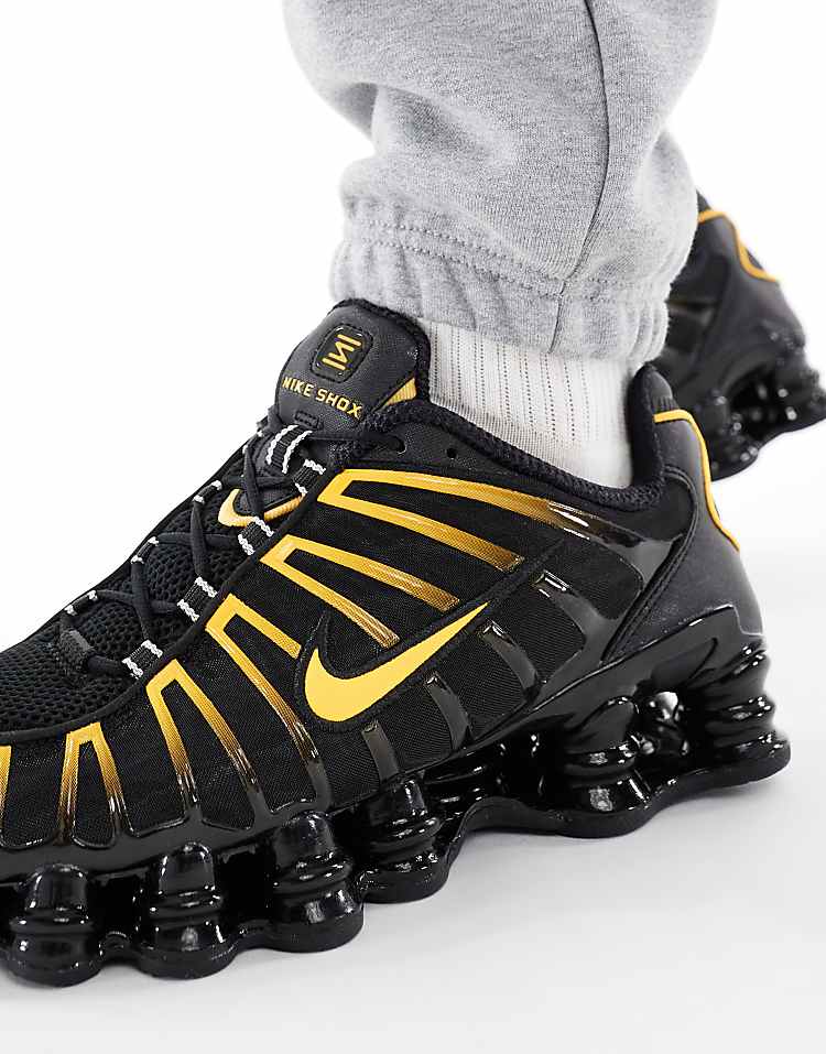 https://images.asos-media.com/products/nike-shox-tl-sneakers-in-black-and-orange/208418069-3?$n_750w$&wid=750&fit=constrain