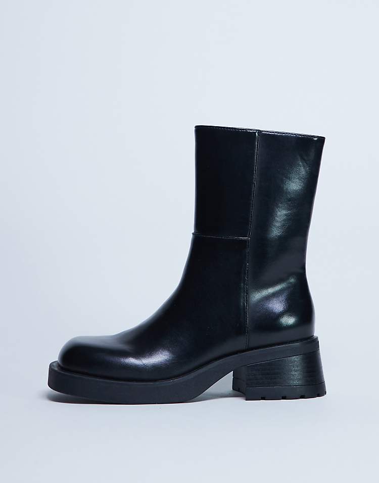 https://images.asos-media.com/products/topshop-nina-chunky-heeled-ankle-boot-in-black/208448688-4?$n_750w$&wid=750&fit=constrain