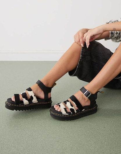https://images.asos-media.com/products/dr-martens-blaire-athena-sandals-in-cow-print/208488669-1-black?$n_750w$&wid=750&fit=constrain