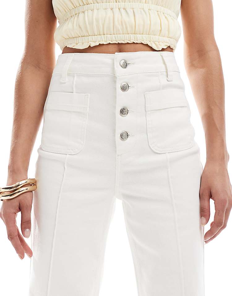 https://images.asos-media.com/products/miss-selfridge-patch-pocket-high-waist-70s-denim-flare-in-ecru-wash/208542246-5?$n_750w$&wid=750&fit=constrain