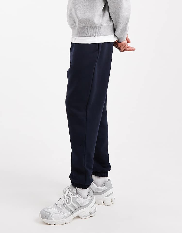 https://images.asos-media.com/products/asos-design-essential-tapered-sweatpants-in-navy/208549001-3?$n_750w$&wid=750&fit=constrain