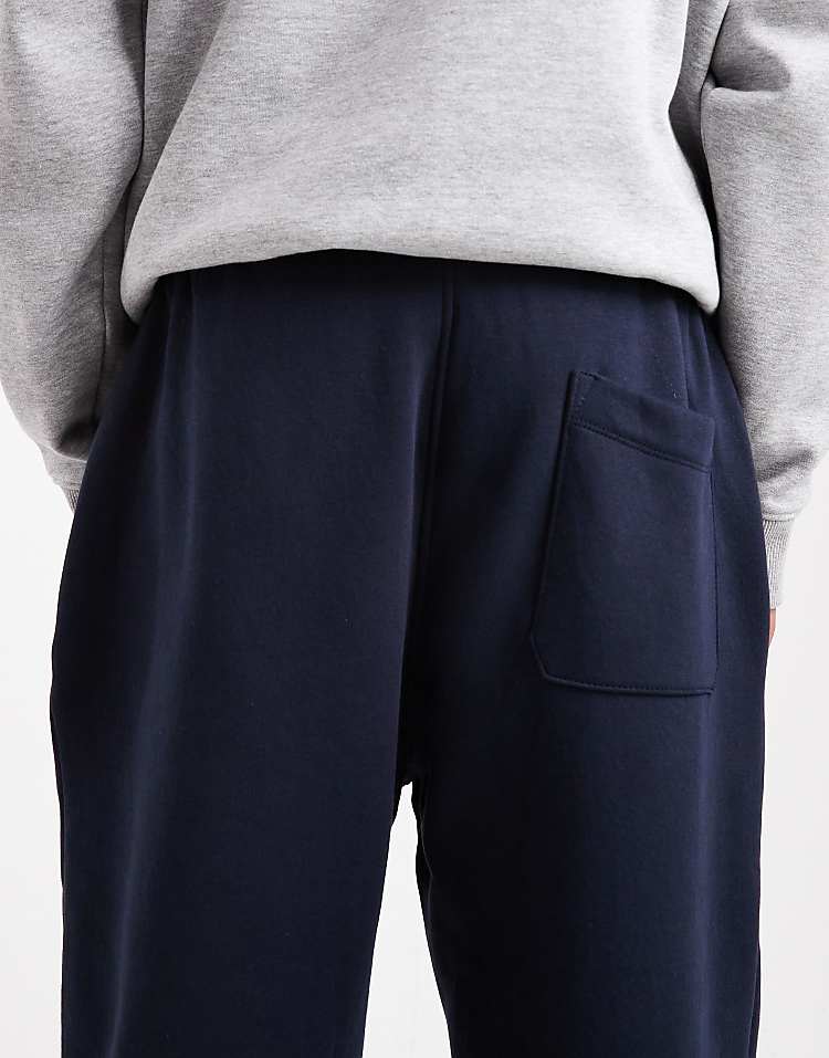 https://images.asos-media.com/products/asos-design-essential-tapered-sweatpants-in-navy/208549001-4?$n_750w$&wid=750&fit=constrain
