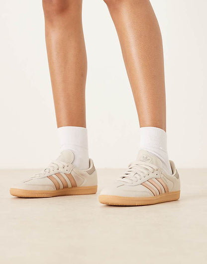 https://images.asos-media.com/products/adidas-originals-samba-og-sneakers-in-white-and-rose-gold/208660949-1-white?$n_750w$&wid=750&fit=constrain