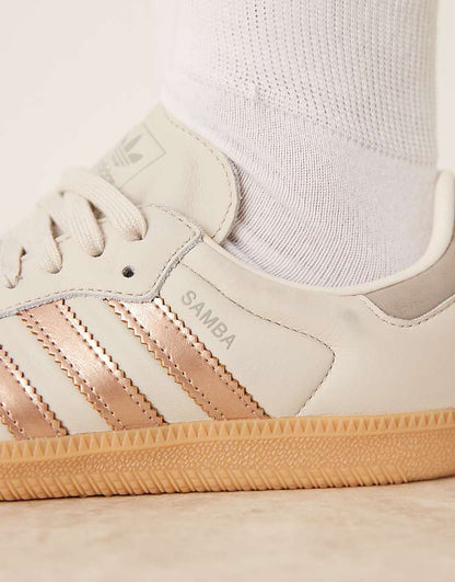 https://images.asos-media.com/products/adidas-originals-samba-og-sneakers-in-white-and-rose-gold/208660949-3?$n_750w$&wid=750&fit=constrain