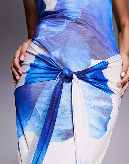 https://images.asos-media.com/products/kaiia-exclusive-double-layered-slinky-mesh-floral-tie-waist-drape-detail-maxi-dress-in-blue-and-ivory/208702704-2?$n_750w$&wid=750&fit=constrain