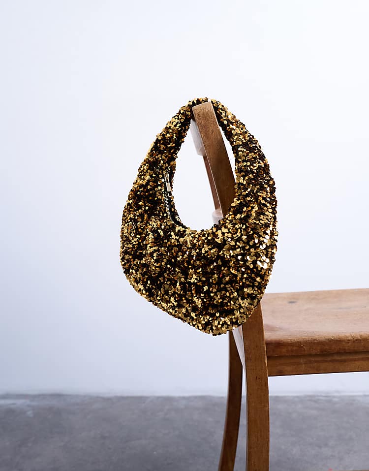 https://images.asos-media.com/products/topshop-santana-scoop-sequin-shoulder-bag-in-gold/208782101-4?$n_750w$&wid=750&fit=constrain