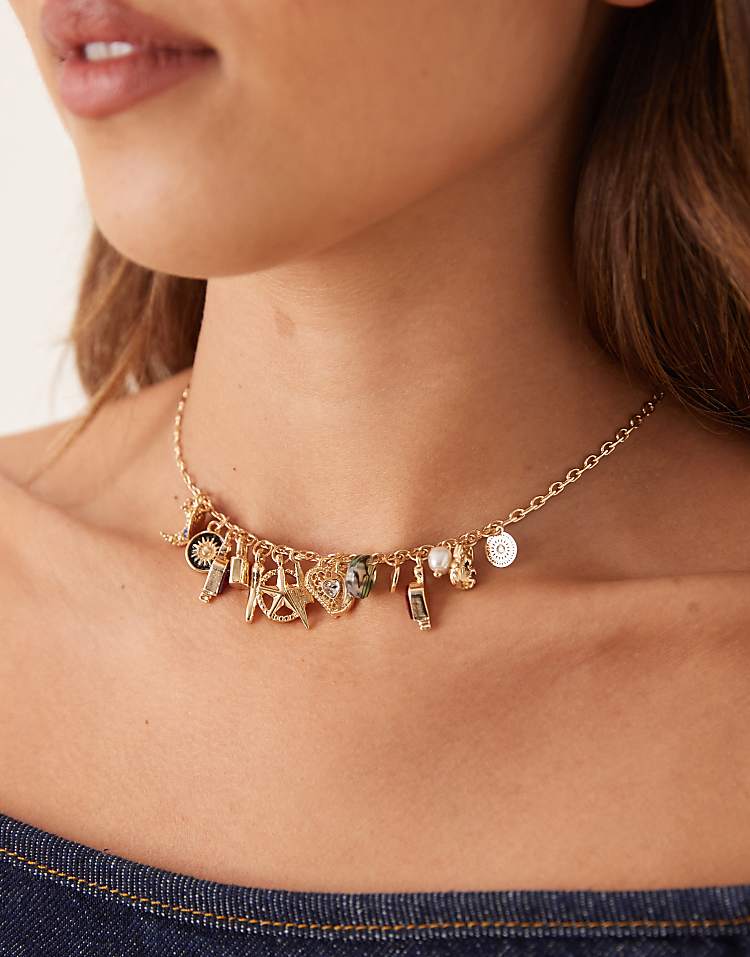 https://images.asos-media.com/products/asos-design-necklace-with-thin-chain-and-small-charm-details-in-gold-tone/208789033-1-gold?$n_750w$&wid=750&fit=constrain