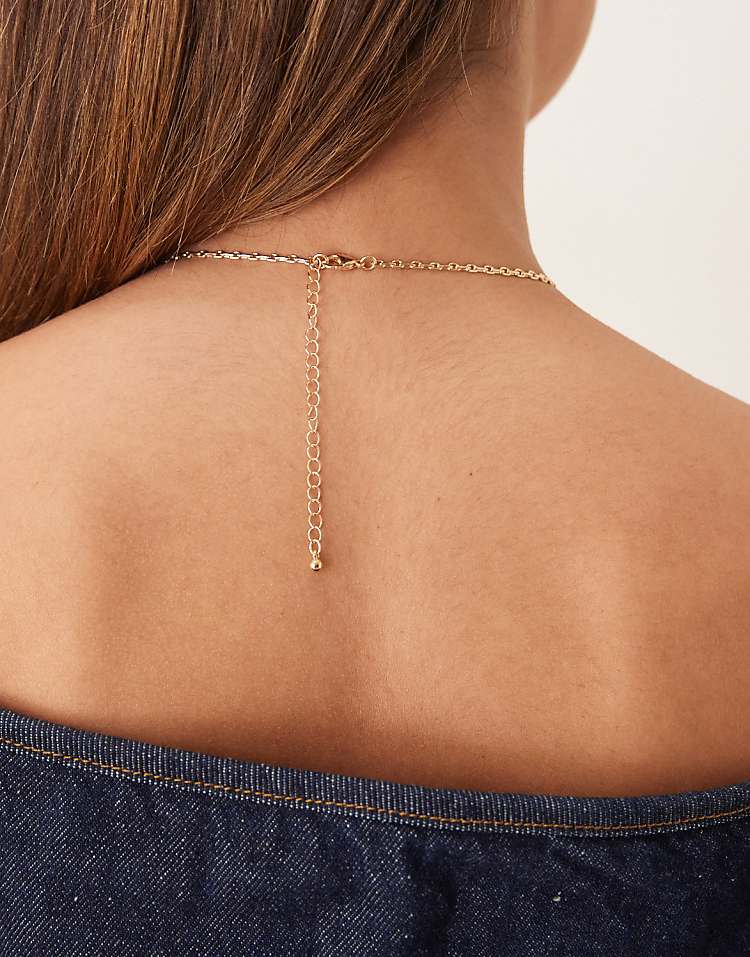 https://images.asos-media.com/products/asos-design-necklace-with-thin-chain-and-small-charm-details-in-gold-tone/208789033-3?$n_750w$&wid=750&fit=constrain