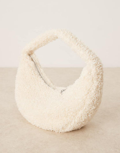 https://images.asos-media.com/products/calvin-klein-sherpa-half-moon-shoulder-bag-in-off-white/208894567-1-beige?$n_750w$&wid=750&fit=constrain