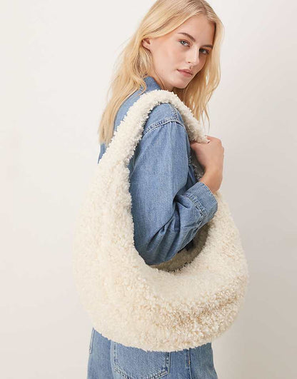 https://images.asos-media.com/products/calvin-klein-sherpa-half-moon-shoulder-bag-in-off-white/208894567-2?$n_750w$&wid=750&fit=constrain