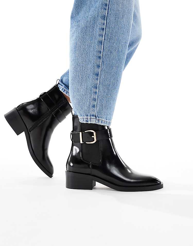 https://images.asos-media.com/products/schuh-cadie-buckle-detail-heeled-chelsea-boots-in-black/209022241-1-black?$n_750w$&wid=750&fit=constrain