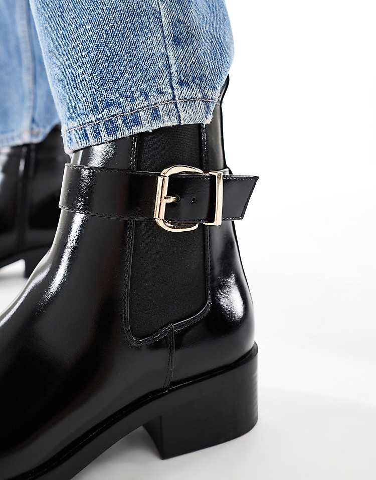 https://images.asos-media.com/products/schuh-cadie-buckle-detail-heeled-chelsea-boots-in-black/209022241-2?$n_750w$&wid=750&fit=constrain