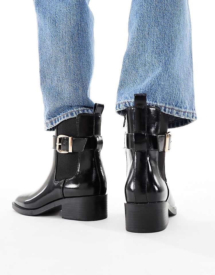 https://images.asos-media.com/products/schuh-cadie-buckle-detail-heeled-chelsea-boots-in-black/209022241-4?$n_750w$&wid=750&fit=constrain