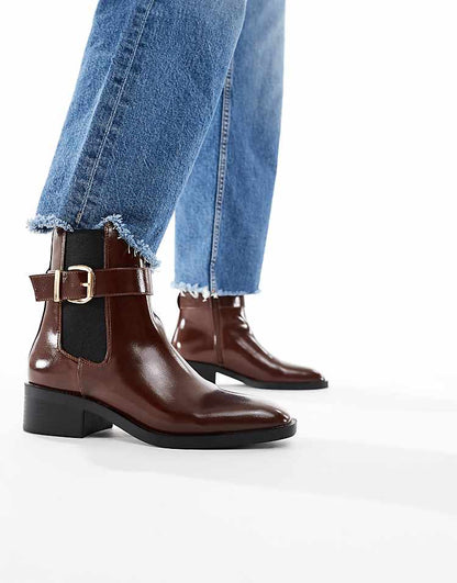 https://images.asos-media.com/products/schuh-cadie-buckle-detailing-heeled-chelsea-boots-in-brown/209022381-1-brown?$n_750w$&wid=750&fit=constrain