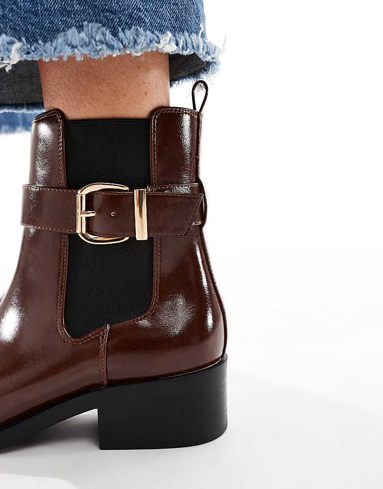 https://images.asos-media.com/products/schuh-cadie-buckle-detailing-heeled-chelsea-boots-in-brown/209022381-3?$n_750w$&wid=750&fit=constrain
