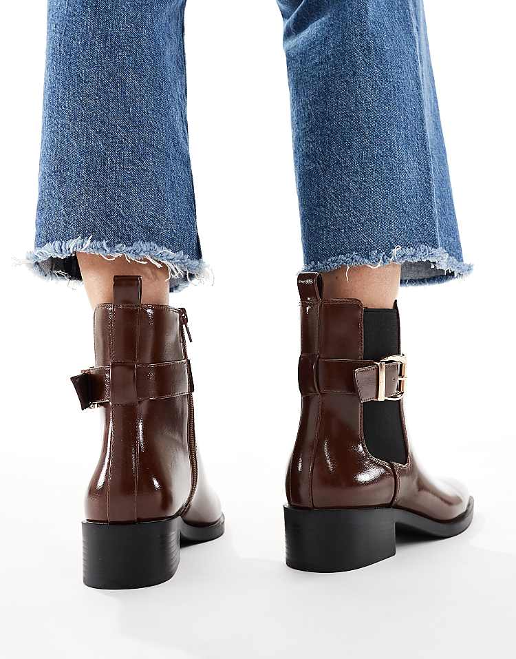 https://images.asos-media.com/products/schuh-cadie-buckle-detailing-heeled-chelsea-boots-in-brown/209022381-4?$n_750w$&wid=750&fit=constrain