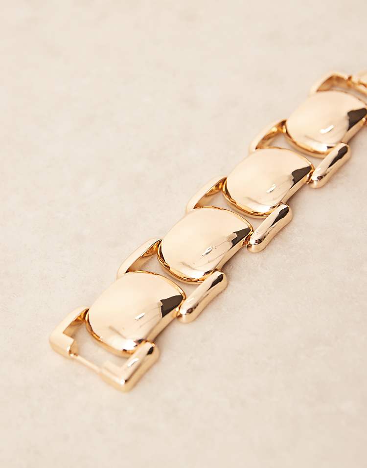 https://images.asos-media.com/products/asos-design-chunky-bracelet-with-vintage-style-design-in-gold-tone/209042232-2?$n_750w$&wid=750&fit=constrain