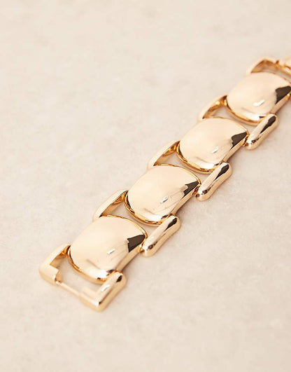 https://images.asos-media.com/products/asos-design-chunky-bracelet-with-vintage-style-design-in-gold-tone/209042232-2?$n_750w$&wid=750&fit=constrain