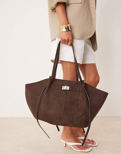 https://images.asos-media.com/products/gina-tricot-faux-suede-medium-tote-bag-with-strap-and-clutch-detail-in-dark-brown/209114717-1-darkbrown?$n_750w$&wid=750&fit=constrain