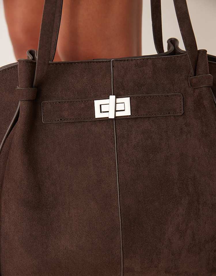 https://images.asos-media.com/products/gina-tricot-faux-suede-medium-tote-bag-with-strap-and-clutch-detail-in-dark-brown/209114717-3?$n_750w$&wid=750&fit=constrain