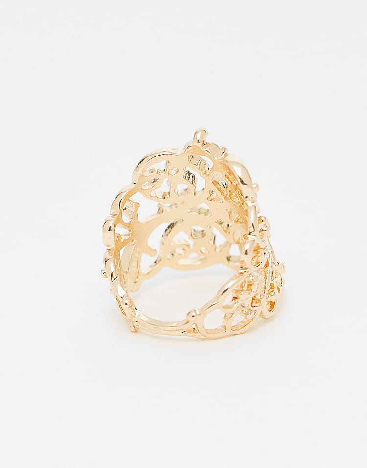https://images.asos-media.com/products/reclaimed-vintage-pretty-cut-work-ring-in-gold/209166466-3?$n_750w$&wid=750&fit=constrain
