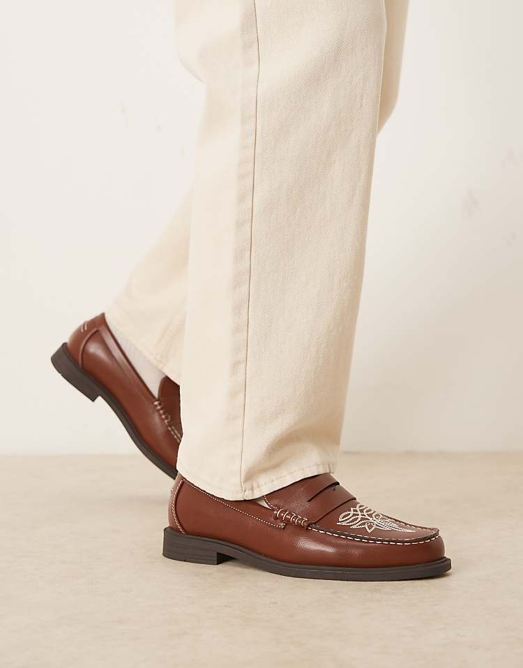 https://images.asos-media.com/products/asos-design-penny-loafers-in-brown-with-western-detailing/209210329-3?$n_750w$&wid=750&fit=constrain