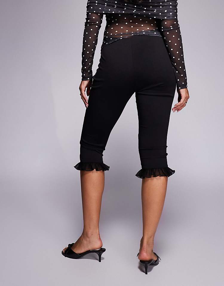 https://images.asos-media.com/products/asos-design-ponte-capri-pants-with-mesh-ruffle-detail-in-black/209514892-5?$n_750w$&wid=750&fit=constrain