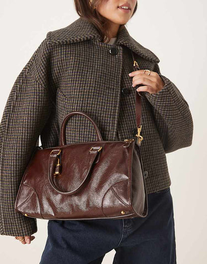 https://images.asos-media.com/products/mango-lock-charm-city-bag-in-deep-brown/209542399-3?$n_750w$&wid=750&fit=constrain
